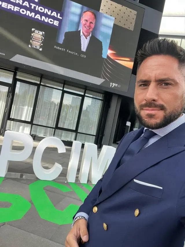 Ramon Lochner outside the PCIM Europe entrance in Nuremberg, beside the show’s freestanding PCIM lettering.